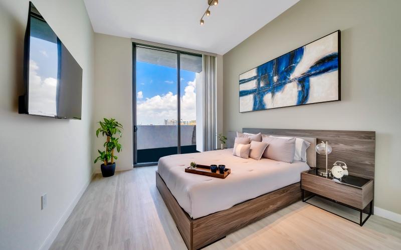 a bedroom with a large window
