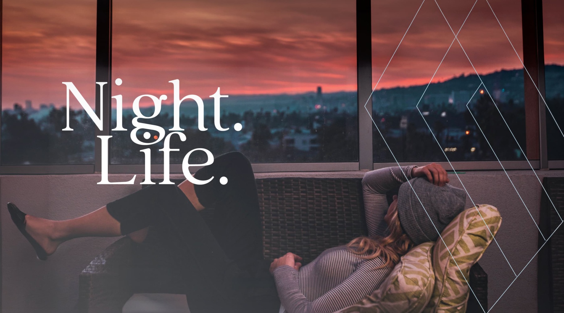 a woman laying down at sunset